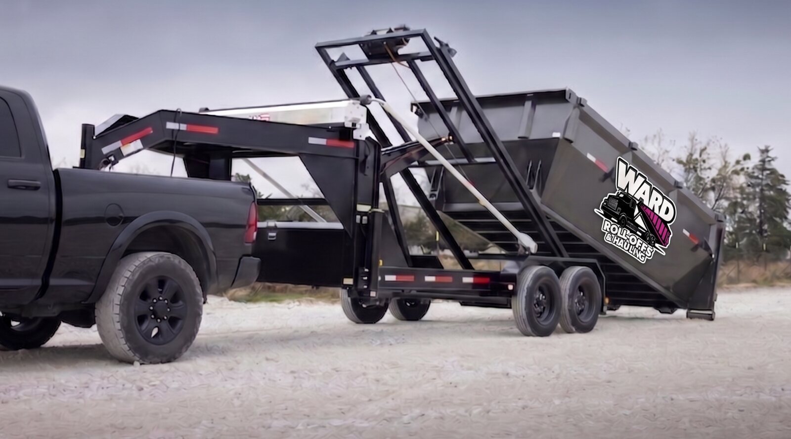Ward roll off dumpster trailer on a job site
